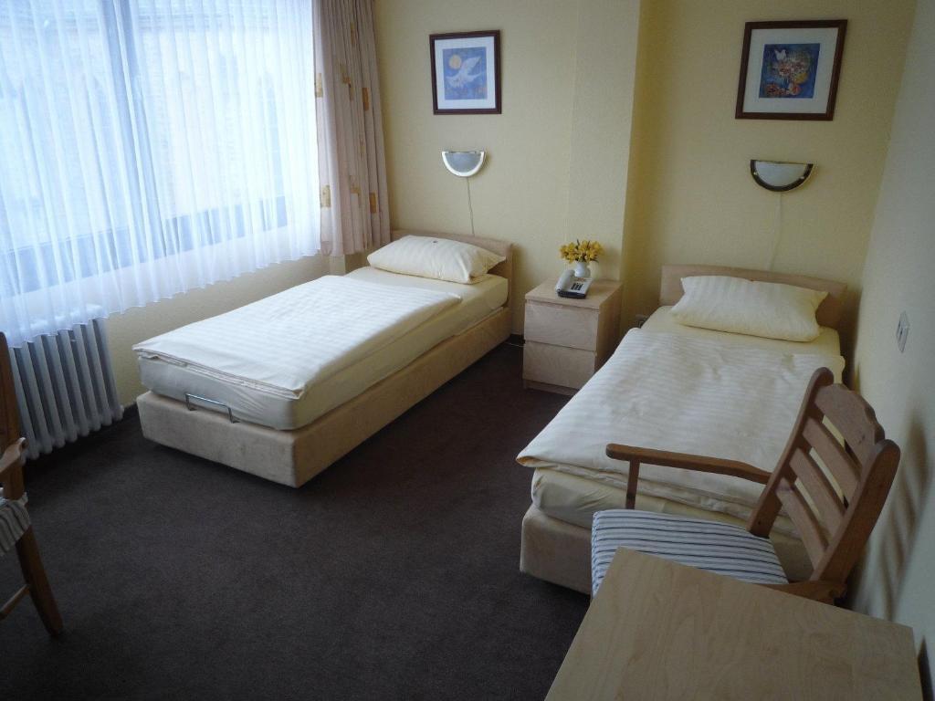 Center Hotel Гютерсло Номер фото